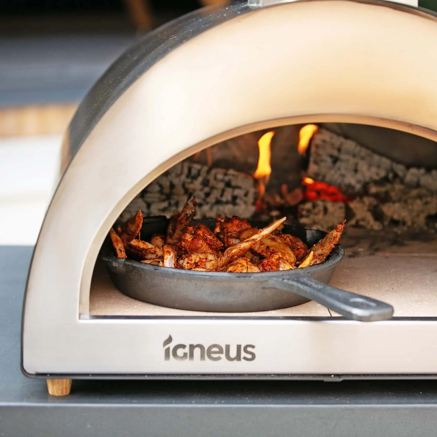 Igneus Classico wood fired pizza oven cooking chicken wings